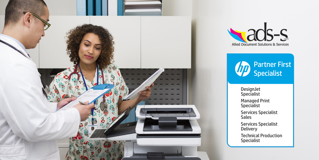 Doctor and nurse discussing hospital charts printed with a HP PageWide Enterprise Color MFP 586z.